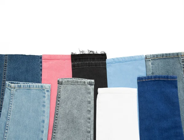 Džínové džíny. Multicolor džíny pozadí. Růžové, šedé, černé a modré barvy. — Stock fotografie