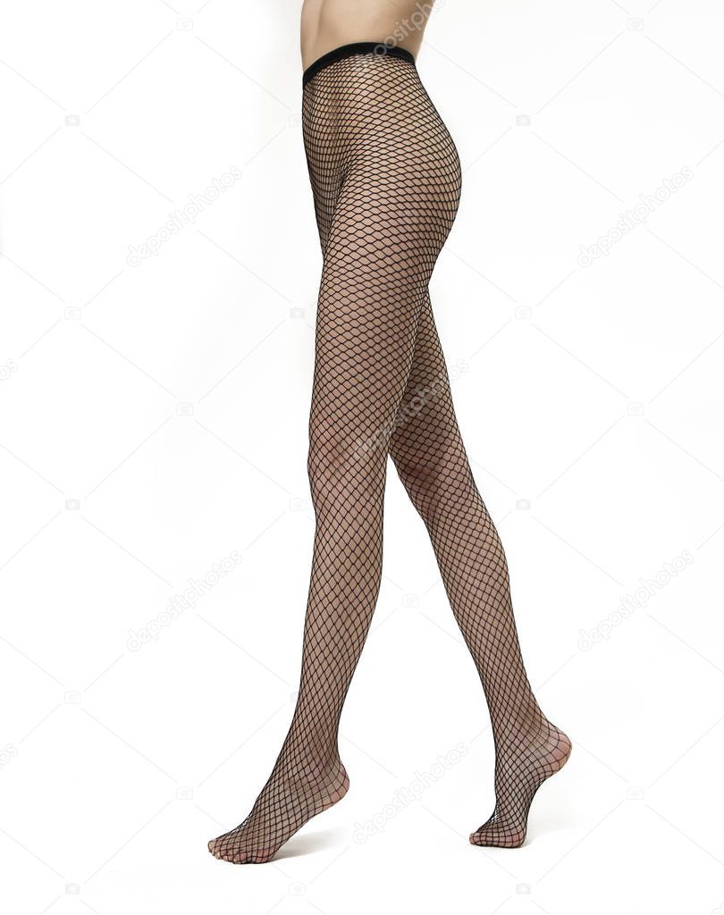 legs with black fishnet tights. Isolated over white background