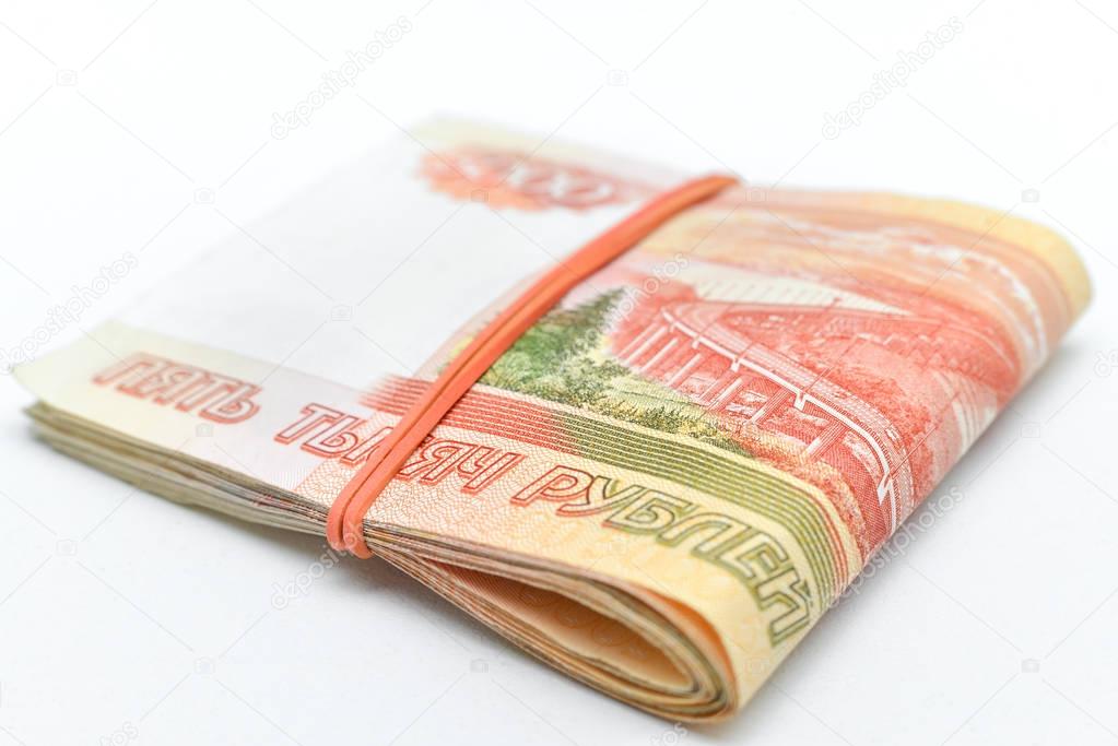 a pack of five thousandth bills tied with a rubber band