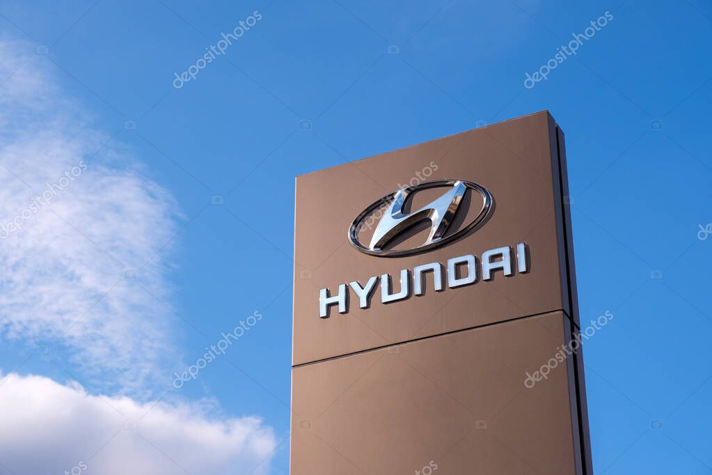 Vologda, Russia - May 3, 2020: Logotype of Hyundai corporation on pillar against blue Sky. Hyundai is the South Korea's automotive manufacturer.