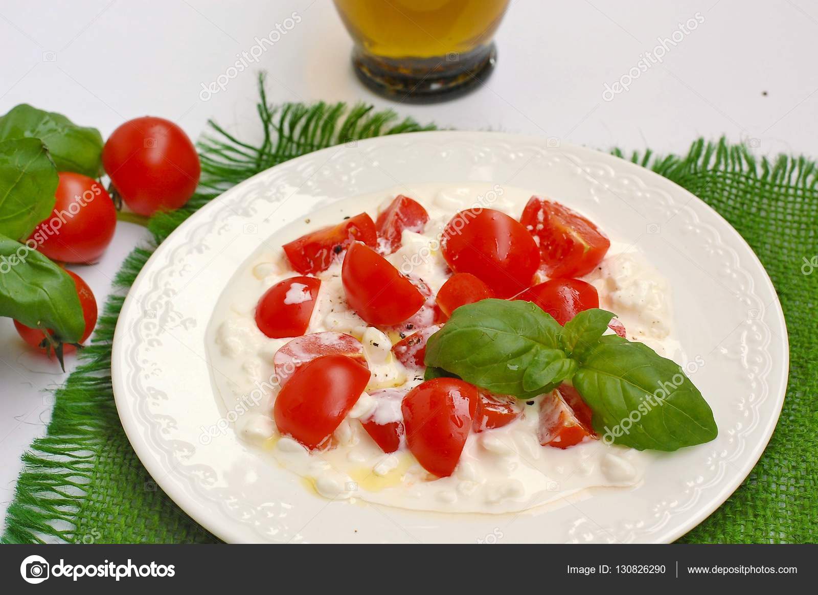 Salad From Cherry Tomatoes And Cottage Cheese With Basil And Olive