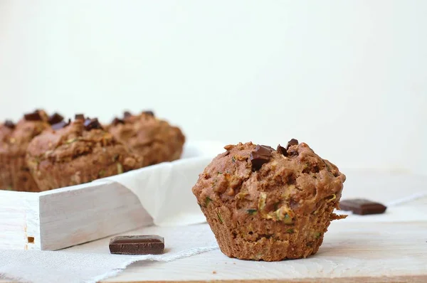 Chocolate muffins on the white and pink background — Stock Photo, Image