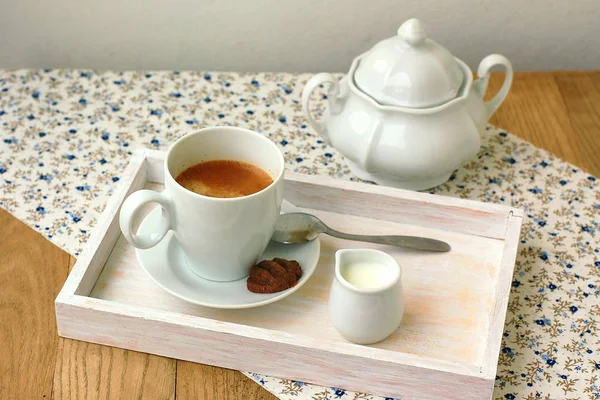 Espresso in the cup with milk, biscuit and sugar basin — Stock Photo, Image