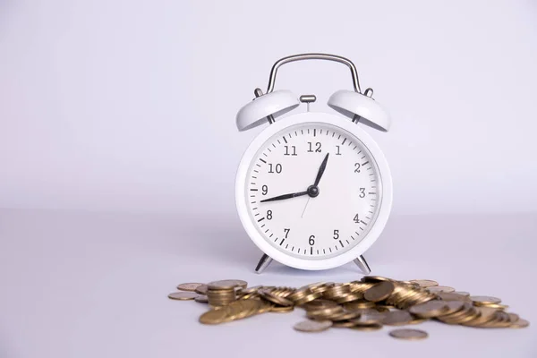 money and clock on a white background