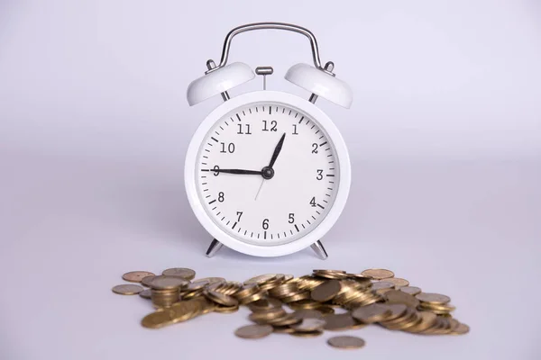 money and clock on a white background