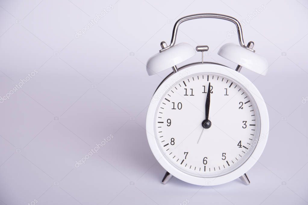 clock with the twelfth hour on a white background