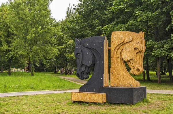 Sculpture made of plywood two chess pieces - black and white hor