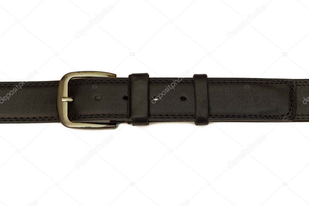 Black leather belt lies on a white background