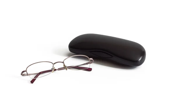 Women's eyeglasses for vision and case lie on white background — Stock Photo, Image