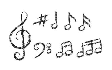 Müzikal işaretlerden oluşan bir kalem seti. Beyaz bir taşrada izole edilmiş.