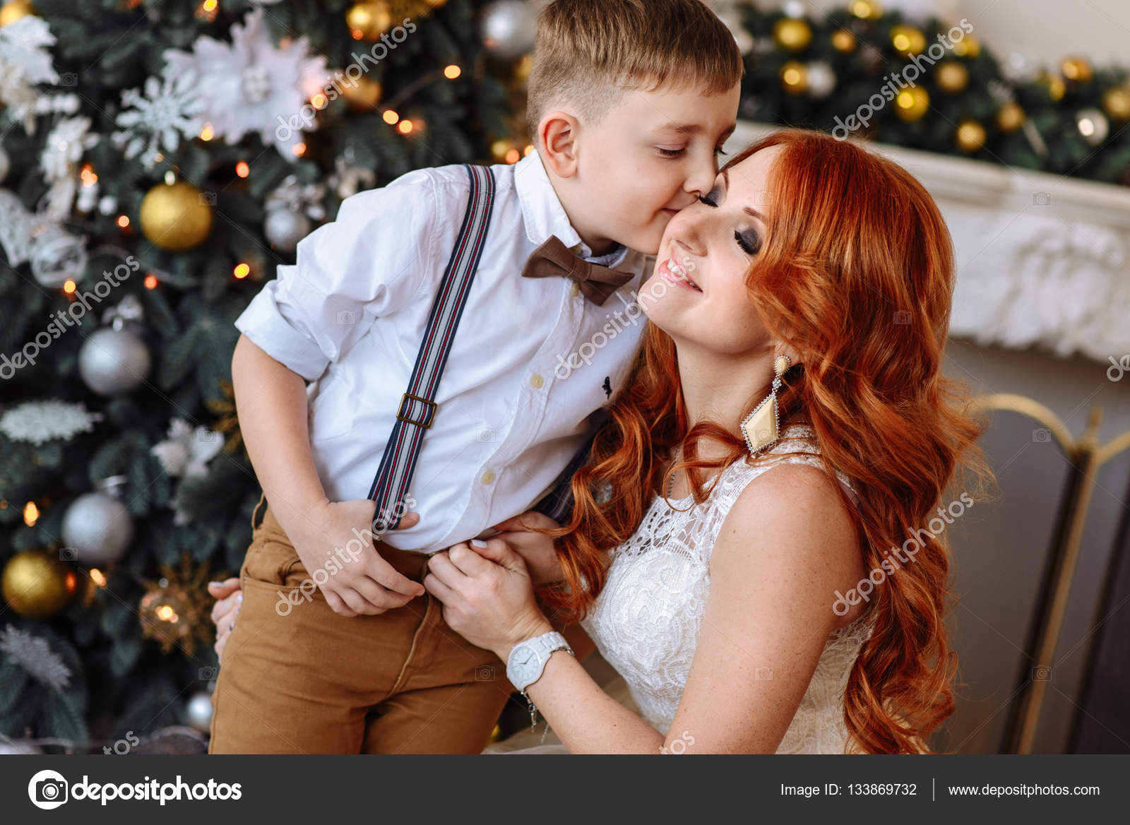 Son Kissing His Mother Near Christmas Tree Stock Photo C Ielanum