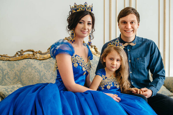 happy young family in royal attire