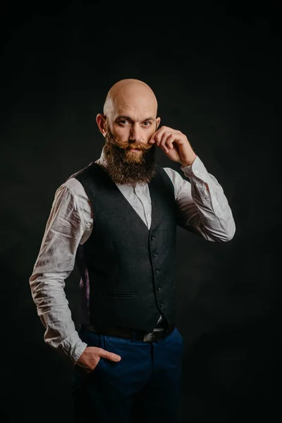 Adult bearded man twirling his fingers mustache — Stock Photo, Image