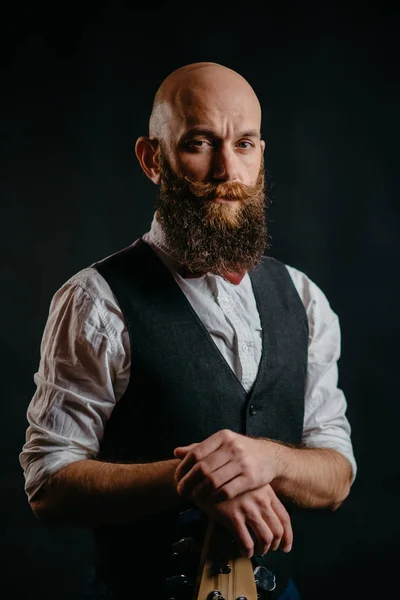 Portrait of a stylish bearded man on a black background — Stock Photo, Image