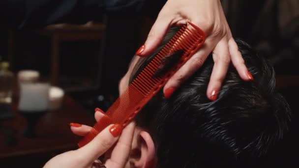 Young bearded man cut in barbershop, close-up — Stock Video