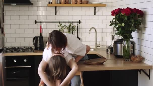 A young couple of lesbians gently cuddle at home. — Stock Video