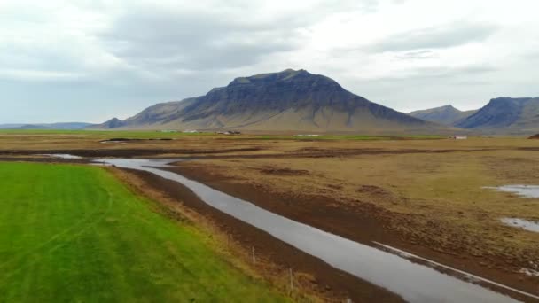 Aerial view of mountain landscape with the plains valley. Iceland. — Stock Video