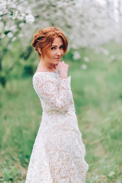 Portrait of a red-haired woman in white blossom. — Stok fotoğraf