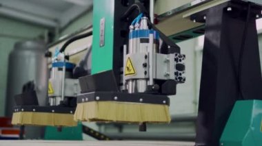 Moving elements of a CNC machine, close-up.