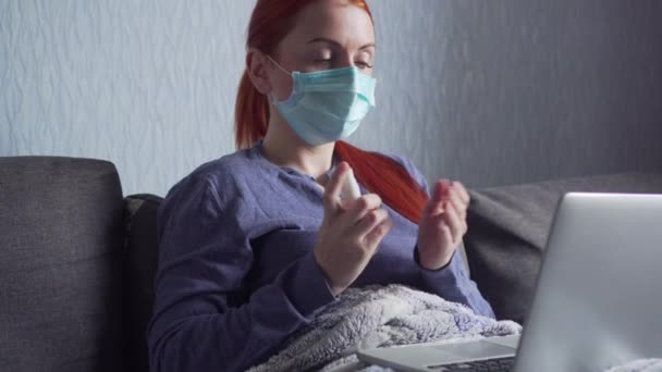 Woman disinfects hands with antiseptic spray. — Stock Video