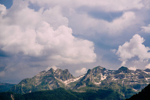 Cloudy sky over the mountain peaks.