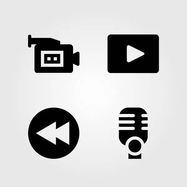 Icônes multimédia réglées. Illustration vectorielle microphone, caméra vidéo, rembobinage et lecteur vidéo — Image vectorielle