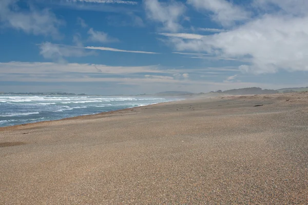 Time on sky and sand of beach