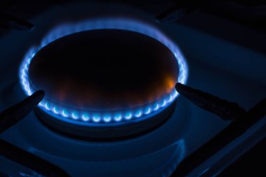 Burning burner gas stove at home clipart