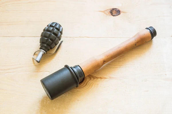 Grenades on wooden board — Stock Photo, Image