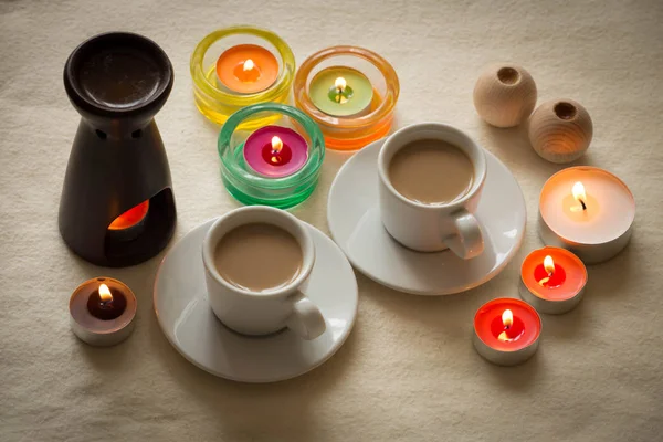 Homemade cup of coffee surrounded by candles / hygge time — Stock Photo, Image