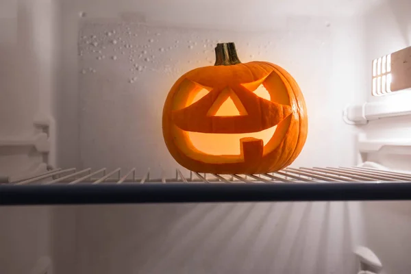Halloween Jack o Lantern, sitting in the refrigerator