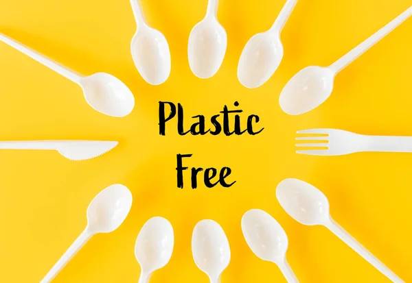 White Plastic Disposable Cutlery Yellow Background Inscription Plastic Free Concept — Stock Photo, Image