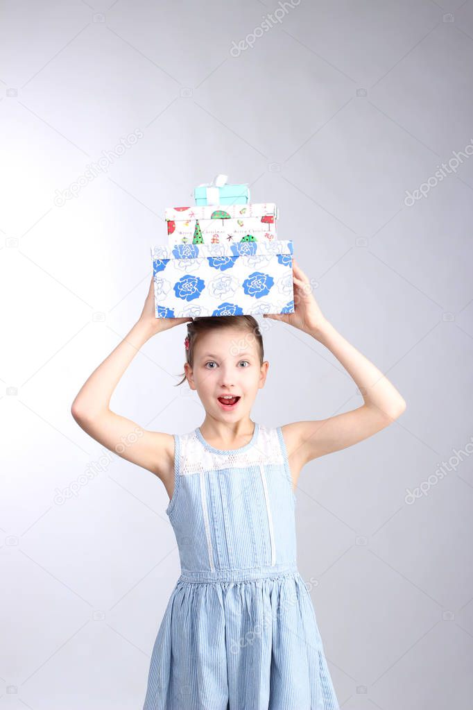 Young little girl holding Christmas present