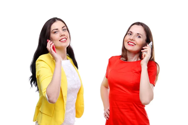 Pretty young women enjoying a conversation on cellphone on white. — Stock Photo, Image