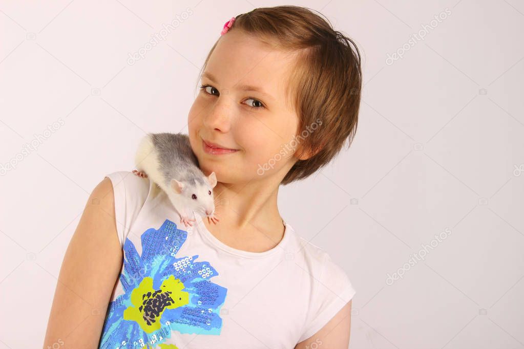   Portrait of a pretty young girl with her pet  rat.