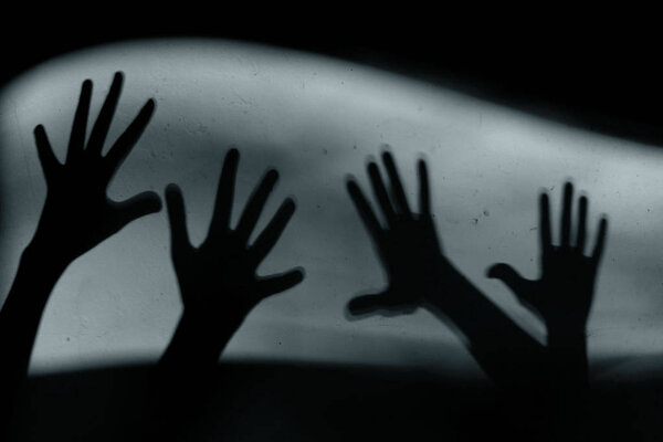 Abstract Background. Black Shadow Of A Big Hand On The Wall. Silhouette Of A Hand On The Wall. Nightmares in Children. Scary Dreams.