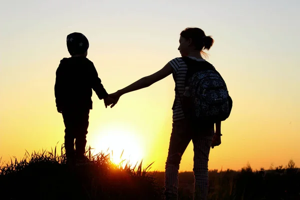 Friendly Family, Children, Travel, Family Value Concept. Elder Sister And Her Younger Brother Looking On Sunset. Children Walking At Sunset. — Stock Image Friendly Family Children Travel Family Value Concept Elder Sister Her Royalty Free Stock Photos