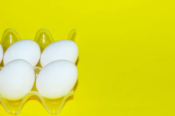 White Chicken Eggs Transparent Stand Yellow Background Abstract Food Background — Stock Photo, Image