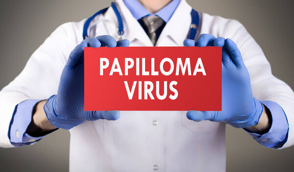 Doctor's hands in blue gloves shows the word papilloma virus. Medical concep