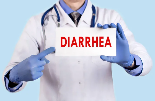 Doctor keeps a card with the name of the diarrhea. Selective focus. Medical concept. — Stock Photo, Image