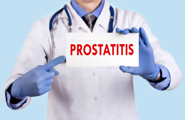 Doctor keeps a card with the name of the prostatitis. Selective focus. Medical concept.