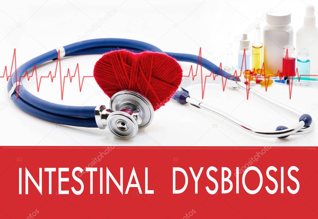 Medical concept, intestinal dysbiosis. Stethoscope and red heart on a white background