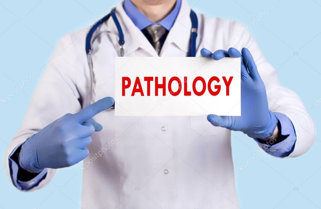 Doctor keeps a card with the name of the pathology. Selective focus. Medical concept.