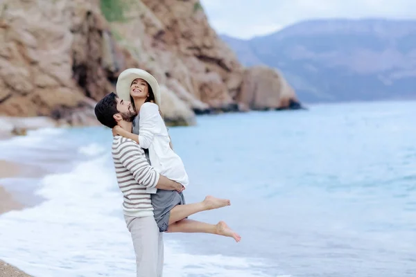 Happy Handsome Man Lifting Pretty Laughing Girl Standing Sea Shore — Stock Photo, Image