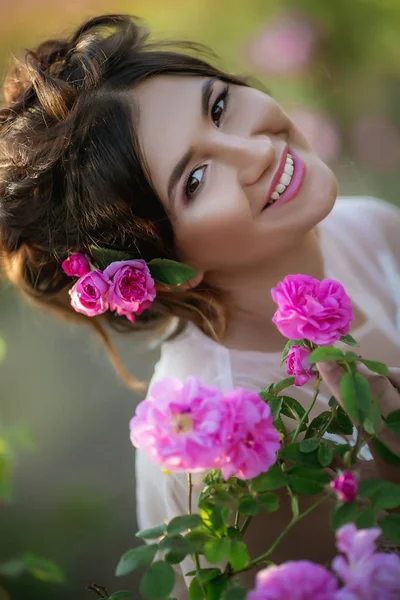 portrait of beautiful young girl woman with pink floral wreath