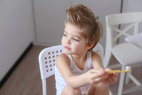 Portrait Funny Little Boy Holding Tooth Brush Sitting White Chair — Stock Photo, Image