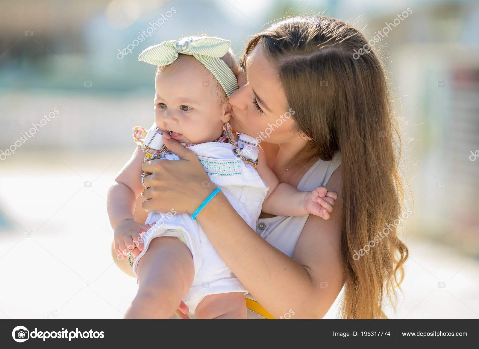 cute baby girl with mom