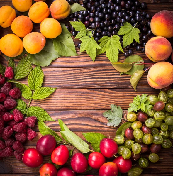 Fresh fruit on wooden table — Stock Photo, Image