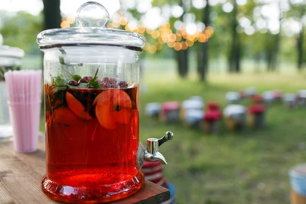 Lemonade and Compote in large glass jar. Summer fruit drink in glass jar. Style rustic. — Stock Photo, Image