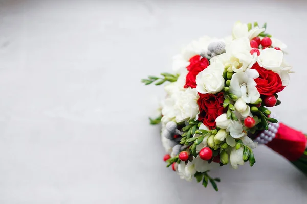 Bridal bouquet close up. red and white roses, freesia, brunia decorated in composition — Stock Photo, Image